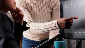 african-american-software-developer-pointing-out-cloud-database_s