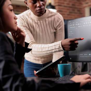african-american-software-developer-pointing-out-cloud-database_s